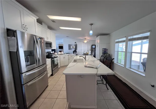 Photo 2 of Manufactured home for sale at 65 Turquoise Ave #65T, Naples, FL 34114 | MLS# 225064920 | Listing updated on 2026-05-15