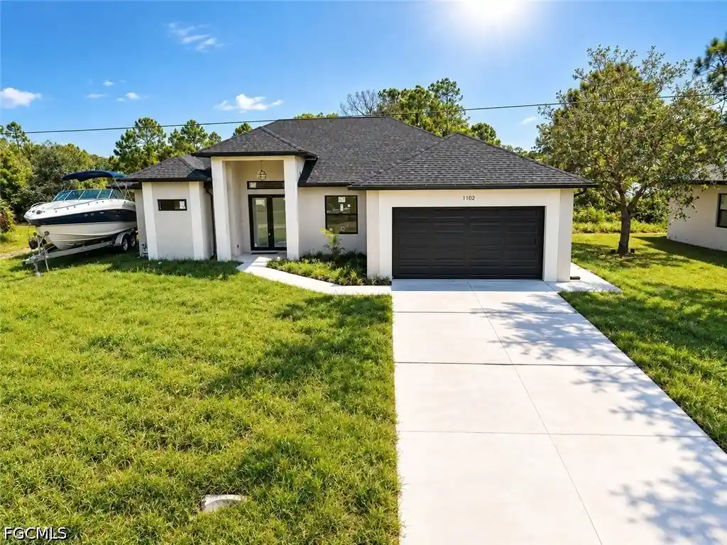 Single family home for sale at 1102 Greenwood Ave, Lehigh Acres, FL 33972 | MLS# 2025008725