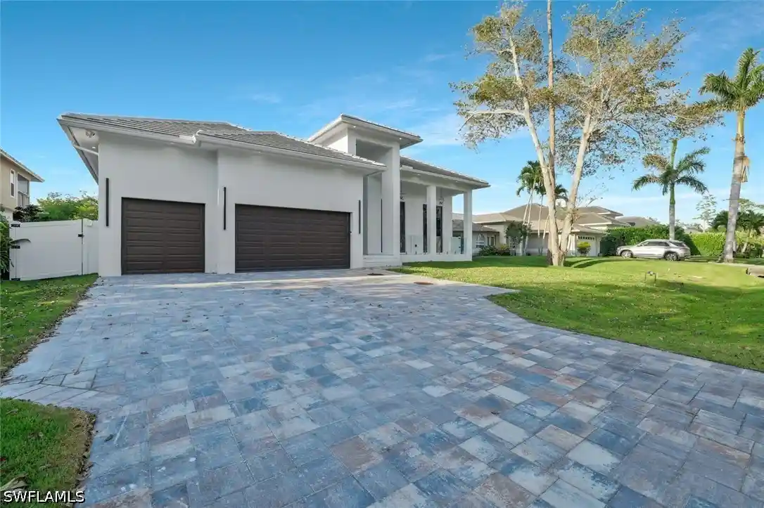 Single family home for sale at 1317 Cypress Woods Dr, Naples, FL 34103 | MLS# 225076400