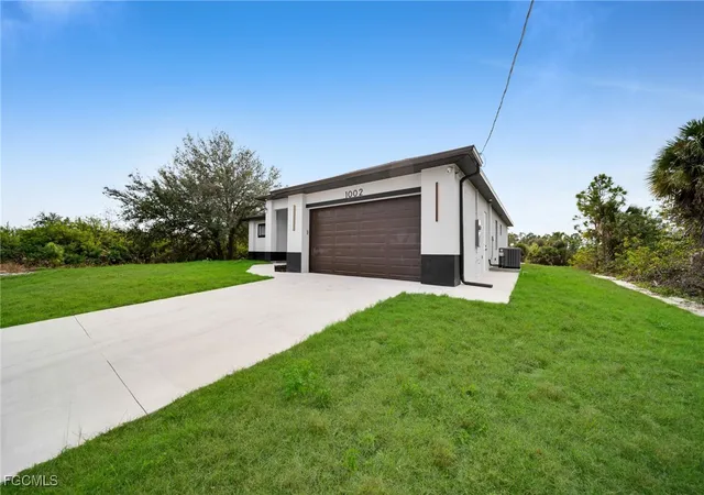 Photo 2 of Single family home for sale at 1002 Kanuga St E, Lehigh Acres, FL 33974 | MLS# 2026002553 | Listing updated on 2026-04-13