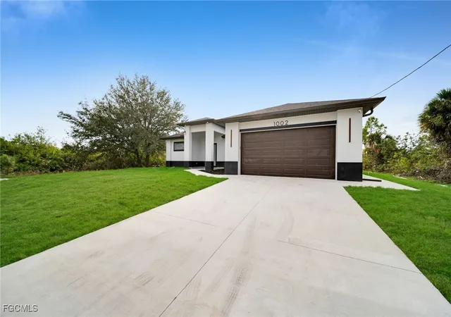 Photo 3 of Single family home for sale at 1002 Kanuga St E, Lehigh Acres, FL 33974 | MLS# 2026002553 | Listing updated on 2026-04-13