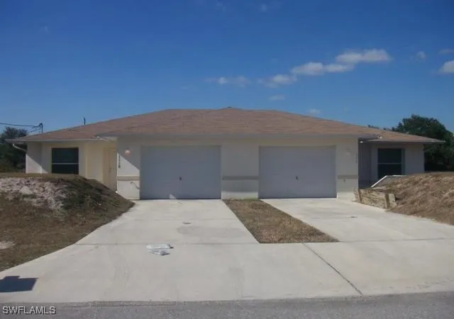 1st image of 1116/1118 Ichabod Ave, Lehigh Acres, FL 33973 | MLS# 226003156