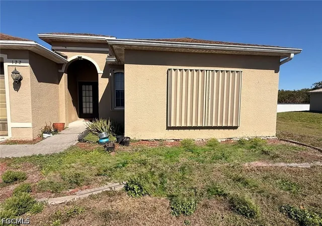 Photo 1 of Single family home for sale at 122 Grant Blvd, Lehigh Acres, FL 33974 | MLS# 2026015139 | Listing updated on 2026-03-31