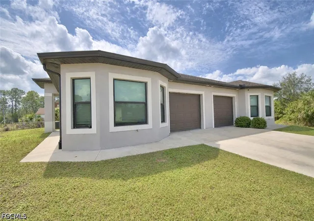 Photo 1 of Multi family home for sale at 713/715 W 12th Street, Lehigh Acres, FL 33972 | MLS# 2026015656 | Listing updated on 2026-05-10