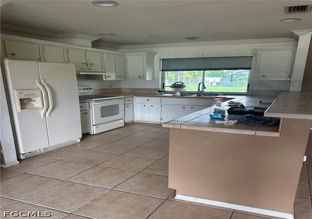 Photo 3 of Single family home for sale at 1404 SE 34th Terrace, Cape Coral, FL 33904 | MLS# 2026019592 | Listing updated on 2026-07-01