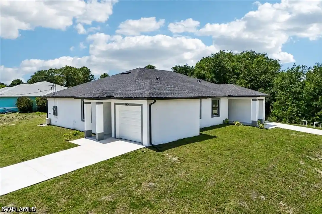 Photo 1 of Multi family home for sale at 2404 2406 Hightower Ave S, Lehigh Acres, FL 33973 | MLS# 226014230 | Listing updated on 2026-10-26