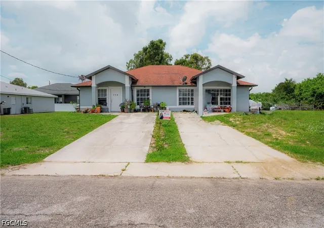 1st image of 716 718 Ichabod Ave, Lehigh Acres, FL 33973 | MLS# 2026023210