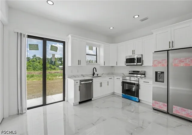 4th image of 2803 1St St W, Lehigh Acres, FL 33971 | MLS# 2026023694