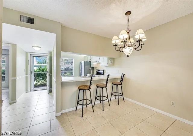 Listing Photo 5 - Condo for sale in building located at 1702 Kings Lake Blvd, Naples, FL 34112 - Unit #102