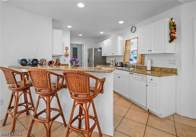 3rd image of 2 E Greens Cir, Lehigh Acres, FL 33936 | MLS# 226025601