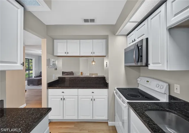 Listing Photo 5 - Condo for sale in building located at 8121 S Woods Cir, Fort Myers, FL 33919 - Unit #9