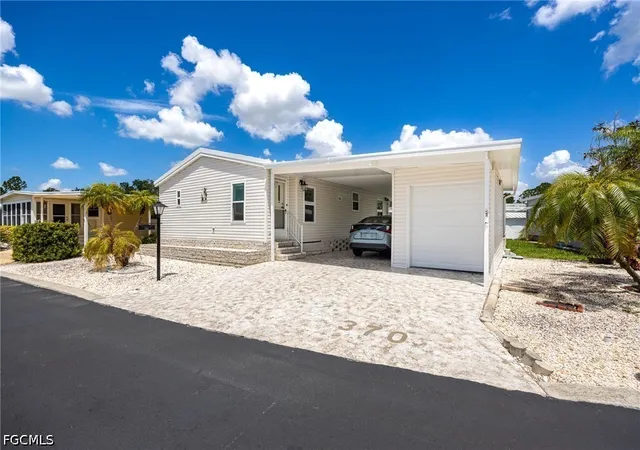 Photo 2 of Manufactured home for sale at 370 Nicklaus Blvd, North Fort Myers, FL 33903 | MLS# 2026030022 | Listing updated on 2026-07-14