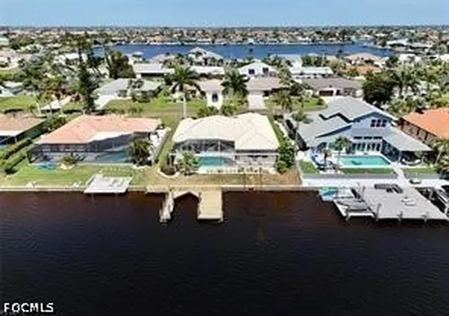 1st image of 702 Sw 52nd St, Cape Coral, FL 33914 | MLS# 2026030382