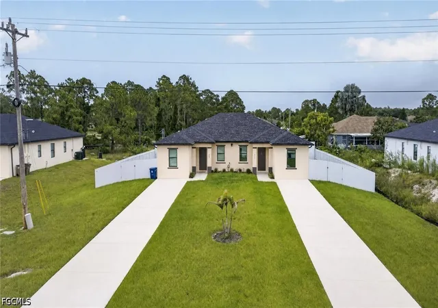 1st image of 909/911 Homestead Rd S, Lehigh Acres, FL 33974 | MLS# 2026031998