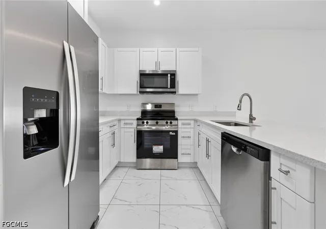 2nd image of 909/911 Homestead Rd S, Lehigh Acres, FL 33974 | MLS# 2026031998