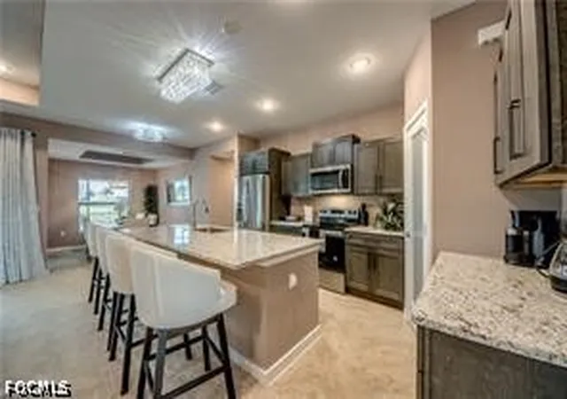 Photo 3 of Single family home for sale at 1042 Nw 32nd Place, Cape Coral, FL 33993 | MLS# 2026033257 | Listing updated on 2026-08-06