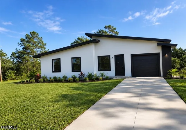 2nd image of 703 Long Island St E, Lehigh Acres, FL 33974 | MLS# 2026033275
