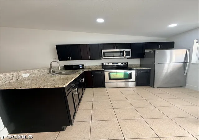 Listing Photo 2 - Condo for sale in building located at 1412-1414 W 12th St, Lehigh Acres, FL 33972