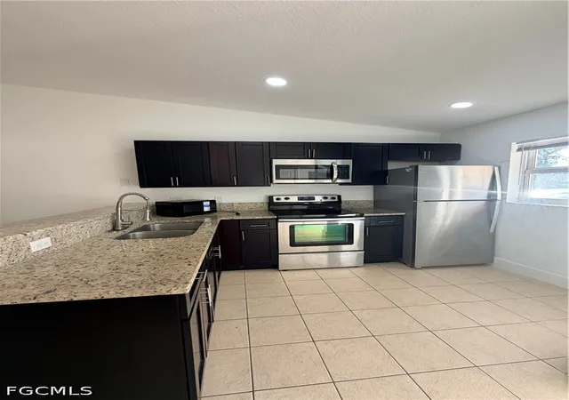 Listing Photo 4 - Condo for sale in building located at 1412-1414 W 12th St, Lehigh Acres, FL 33972