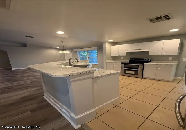 3rd image of 3122 12th Street SW, Lehigh Acres, FL 33976 | MLS# 226028885