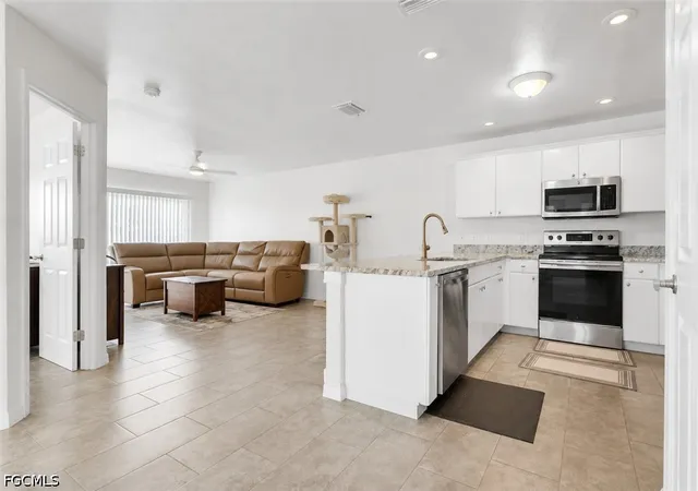 Listing Photo 4 - Condo for sale in building located at 405/407 NE 24th Ave, Cape Coral, FL 33909
