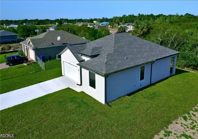 Photo 2 of Single family home for sale at 605 Greenbriar Blvd, Lehigh Acres, FL 33972 | MLS# 2026039132 | Listing updated on 2026-09-23