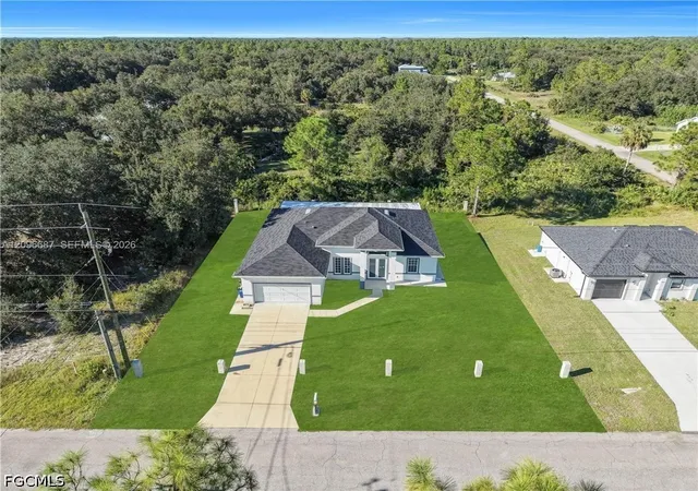 Photo 1 of Single family home for sale at 105 15 Street E, Lehigh Acres, FL 33972 | MLS# 2026040972 | Listing updated on 2026-09-30