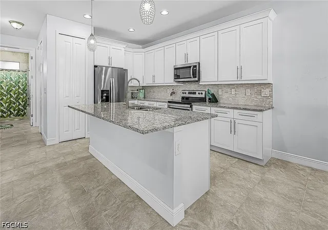 Photo 3 of Single family home for sale at 1703 Sw 12th Terrace, Cape Coral, FL 33991 | MLS# 2026041913 | Listing updated on 2026-10-08