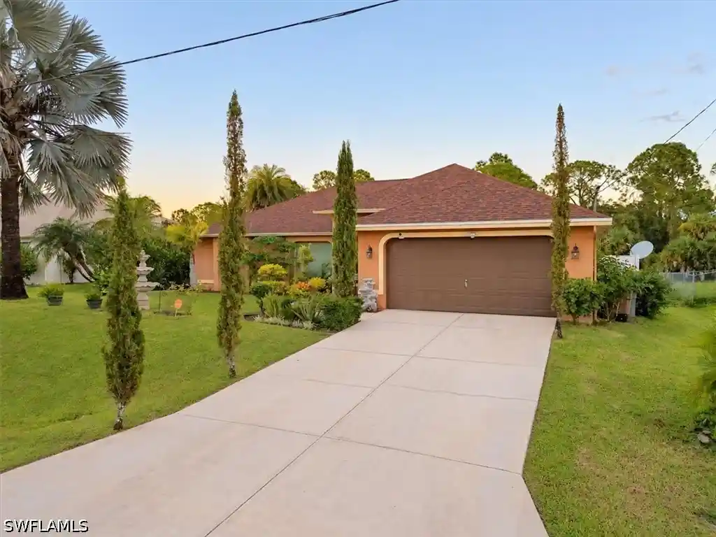 Single family home for sale at 1063 Lilac St E, Lehigh Acres, FL 33974 | MLS# 226032623