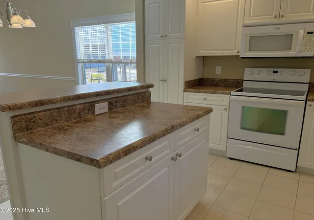 Photo 3 of Single family home for sale at 115 NW 20th Street, Oak Island, NC 28465 | MLS# 100589420 | Listing updated on 2026-08-18
