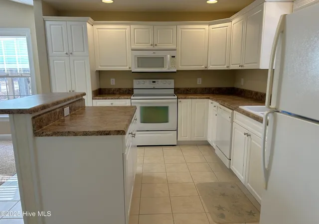 Photo 5 of Single family home for sale at 115 NW 20th Street, Oak Island, NC 28465 | MLS# 100589420 | Listing updated on 2026-08-18