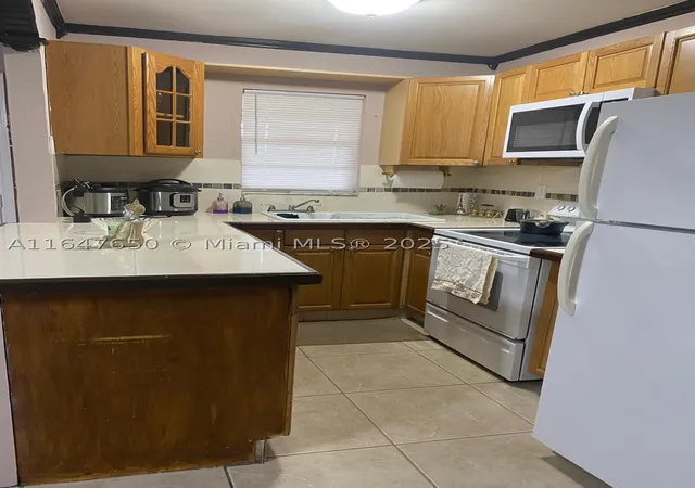 Photo 2 of Condo for sale at 4050 Nw 135Th St #20-1, Opa Locka, FL 33054 | MLS# A11647650 | Listing updated on 2026-01-19