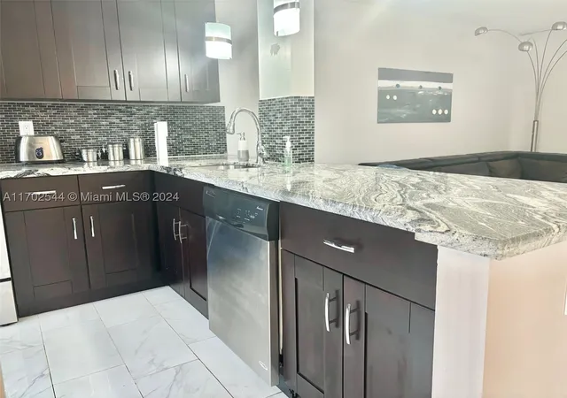 Photo 1 of Condo for sale at 1445 Atlantic Shores Blvd #102, Hallandale Beach, FL 33009 | MLS# A11702544 | Listing updated on 2026-02-28