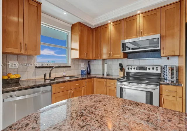 Photo 1 of Condo for sale at 137 Golden Isles Dr #1105, Hallandale Beach, FL 33009 | MLS# A11798702 | Listing updated on 2026-10-08