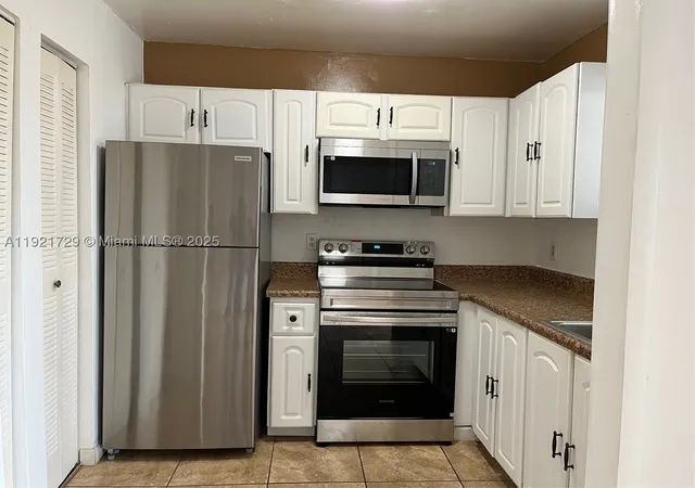 Photo 1 of Condo for sale at 13500 Ne 3Rd Ct #402, North Miami, FL 33161 | MLS# A11921729 | Listing updated on 2026-04-10