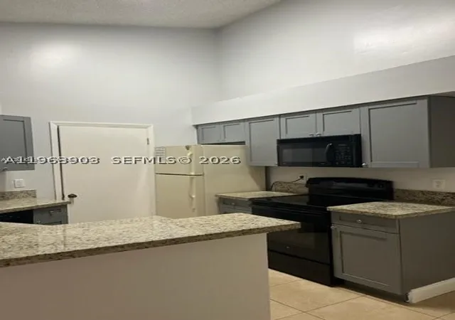 Photo 1 of Condo for sale at 9999 Summerbreeze Dr #1009, Sunrise, FL 33322 | MLS# A11963903 | Listing updated on 2026-07-27