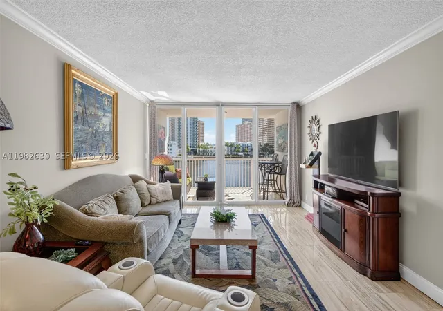 Listing Photo 2 - Condo for sale in building located at 121 Golden Isles Dr, Hallandale Beach, FL 33009 - Unit #205