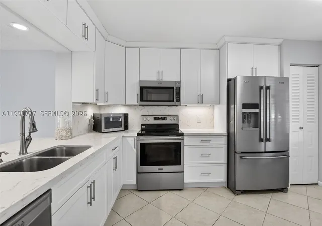 Photo 1 of Condo for sale at 901 Sw 128th Ter #102A, Pembroke Pines, FL 33027 | MLS# A11991777 | Listing updated on 2026-10-08