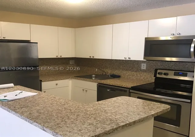 Photo 1 of Condo for sale at 7200 Nw 179th St #302, Hialeah, FL 33015 | MLS# A12000890 | Listing updated on 2026-04-23
