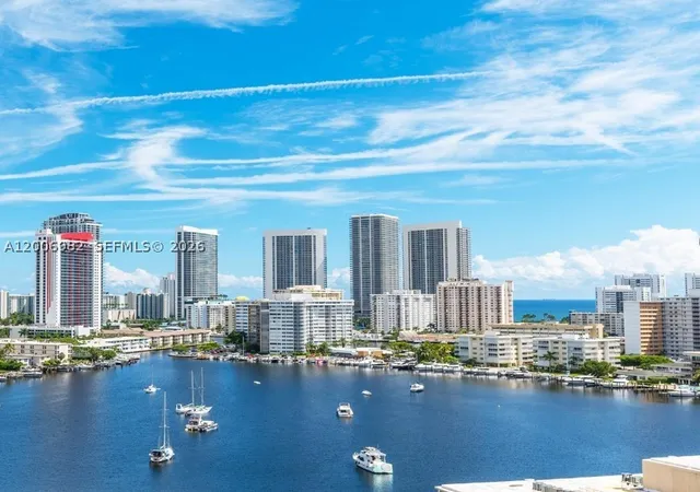 Listing Photo 1 - Condo for sale in building located at 427 Golden Isles Dr, Hallandale Beach, FL 33009 - Unit #7J