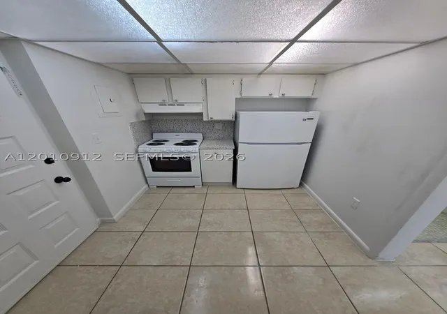 Listing Photo 1 - Condo for sale in building located at 6980 Nw 186Th St, Miami, FL 33015 - Unit #3-227A