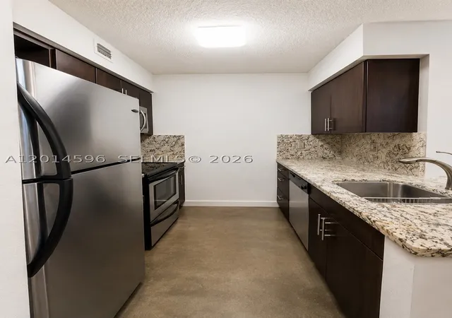 Photo 2 of Condo for sale at 2890 N Oakland Forest Dr #203, Oakland Park, FL 33309 | MLS# A12014596 | Listing updated on 2026-07-23