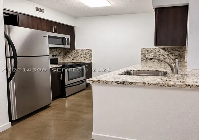 Photo 3 of Condo for sale at 2890 N Oakland Forest Dr #203, Oakland Park, FL 33309 | MLS# A12014596 | Listing updated on 2026-07-23