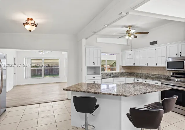 Photo 3 of Single family home for sale at 310 E Olive Ave, Port St Lucie, FL 34952 | MLS# A12025477 | Listing updated on 2026-08-22