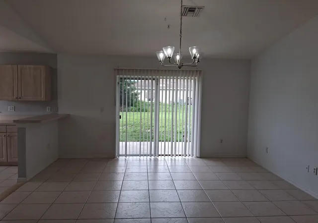 5th image of 113 S John Ave Ave S, Lehigh Acres, FL 33973 | MLS# B26036836