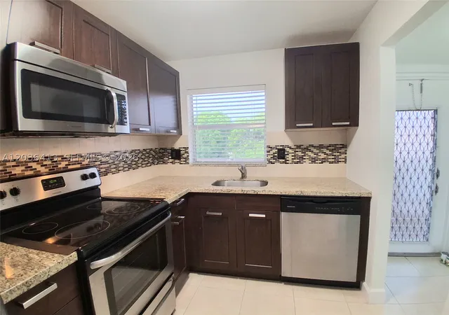 Listing Photo 1 - Condo for sale in building located at 9460 Sunrise Lakes Blvd, Sunrise, FL 33322 - Unit #309
