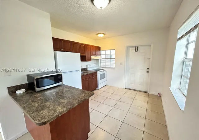 Photo 2 of Multi family home for sale at 990 Phippen Waiters Rd, Dania, FL 33004 | MLS# A12041857 | Listing updated on 2026-07-08
