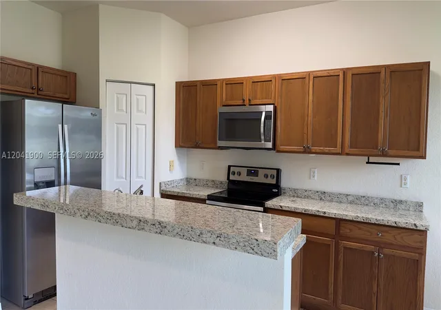 Photo 3 of Townhouse for sale at 3042 Grandiflora Dr, Green Acres, FL 33467 | MLS# A12041900 | Listing updated on 2026-10-07