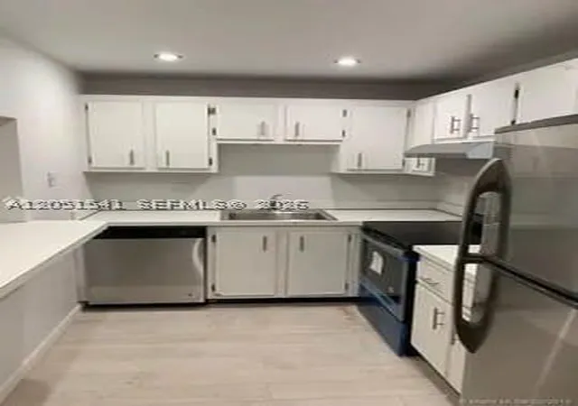 Listing Photo 1 - Condo for sale in building located at 4168 Inverrary Dr, Lauderhill, FL 33319 - Unit #305