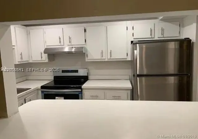 Listing Photo 2 - Condo for sale in building located at 4168 Inverrary Dr, Lauderhill, FL 33319 - Unit #305